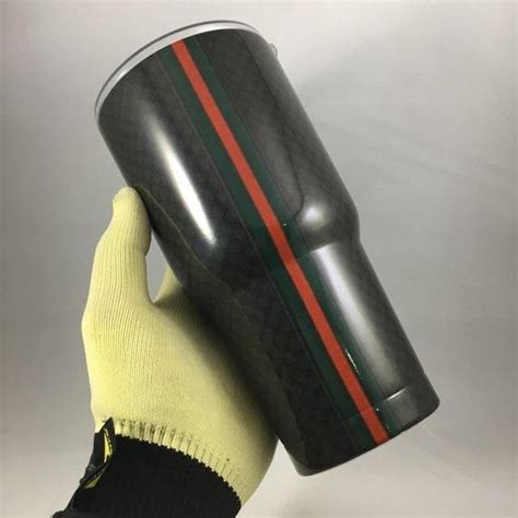 black gucci tumbler wrap.